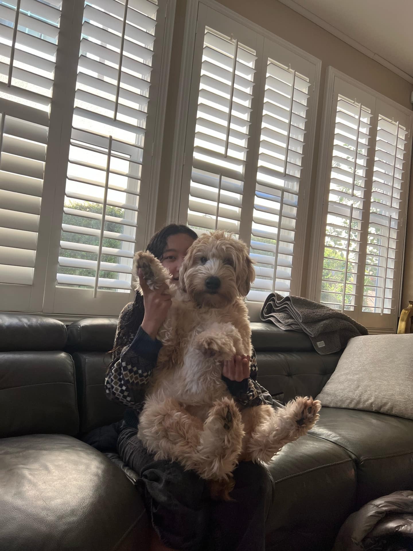 Taylin holding Evie on the couch